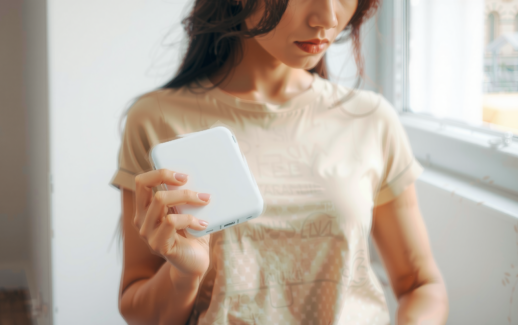 Anker PowerCore Essential 20000mAh portable charger — lifestyle photo showing Anker PowerCore Essential 20K in use